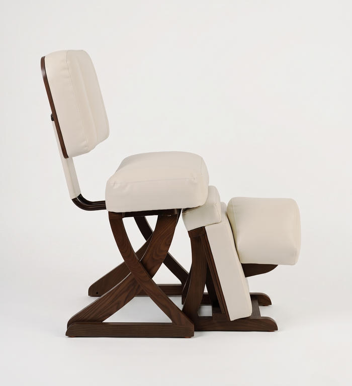 Kneeling chair with wooden frame and beige cushion on a white background