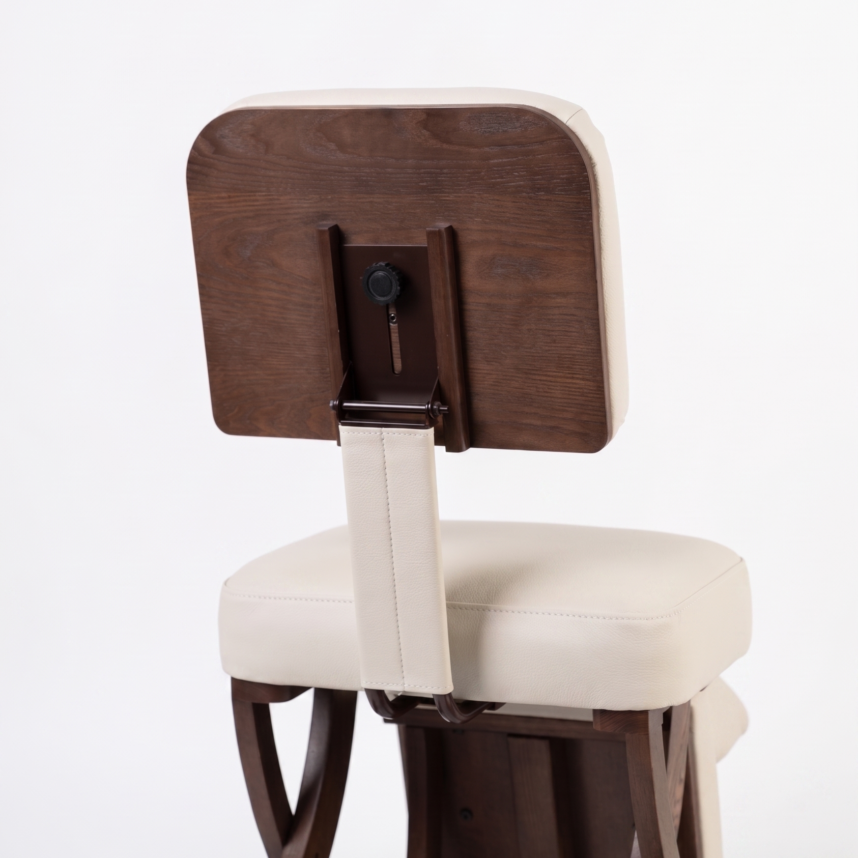 Meditation chair with wooden backrest and white cushion on a white background
